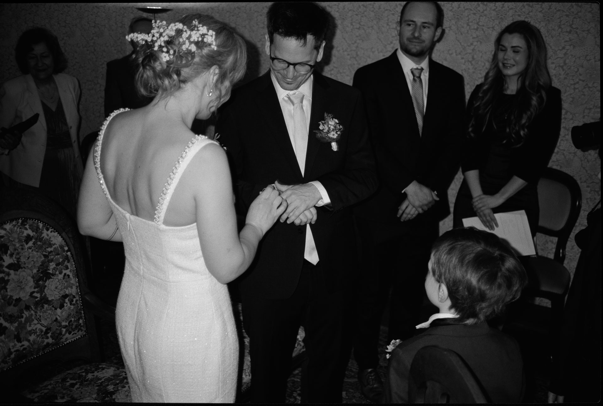 The couple exchanging rings, in black and white, Irena & Peter wedding in Berlin