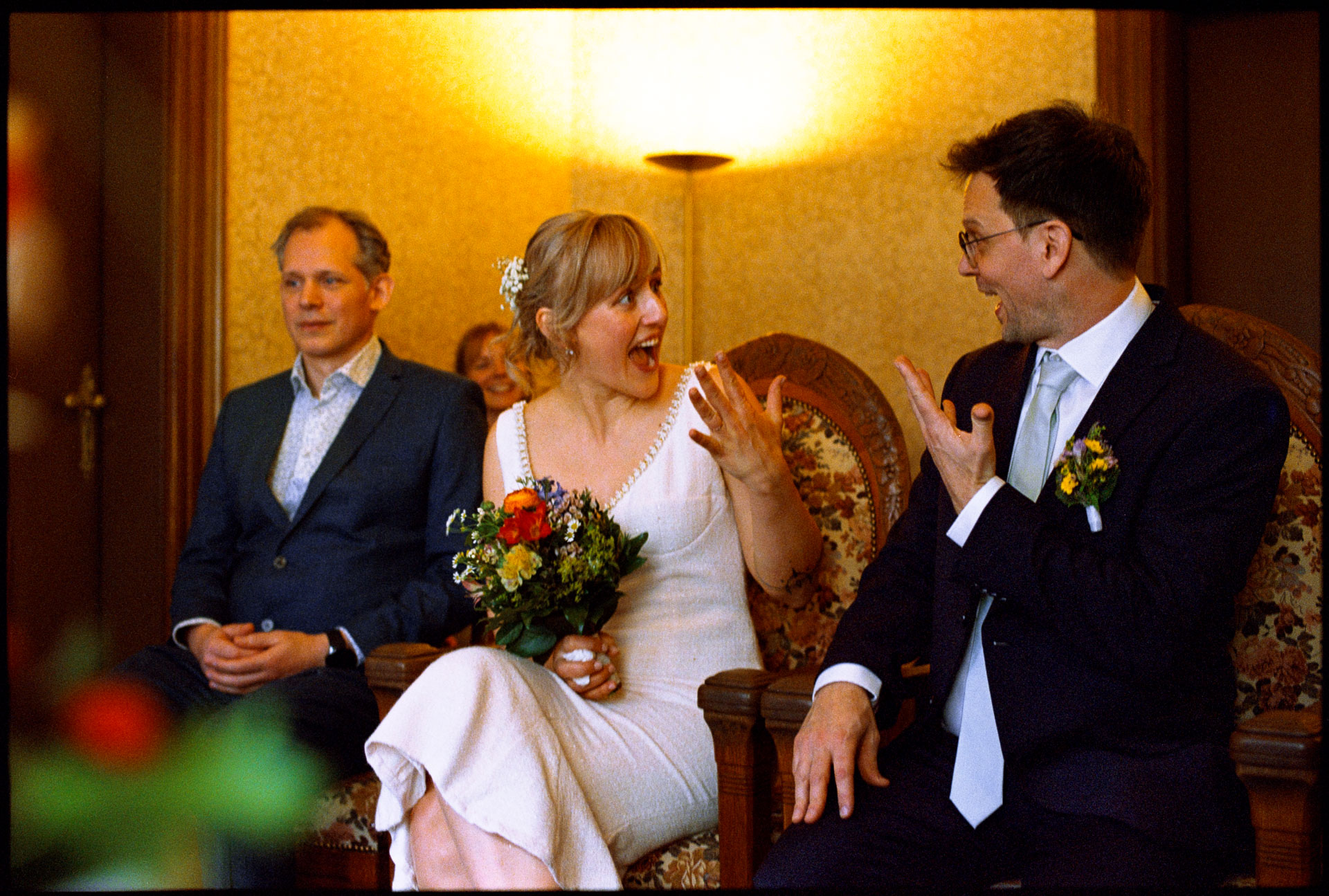 The couple laughing with a guest at the ceremony, Irena & Peter wedding in Berlin