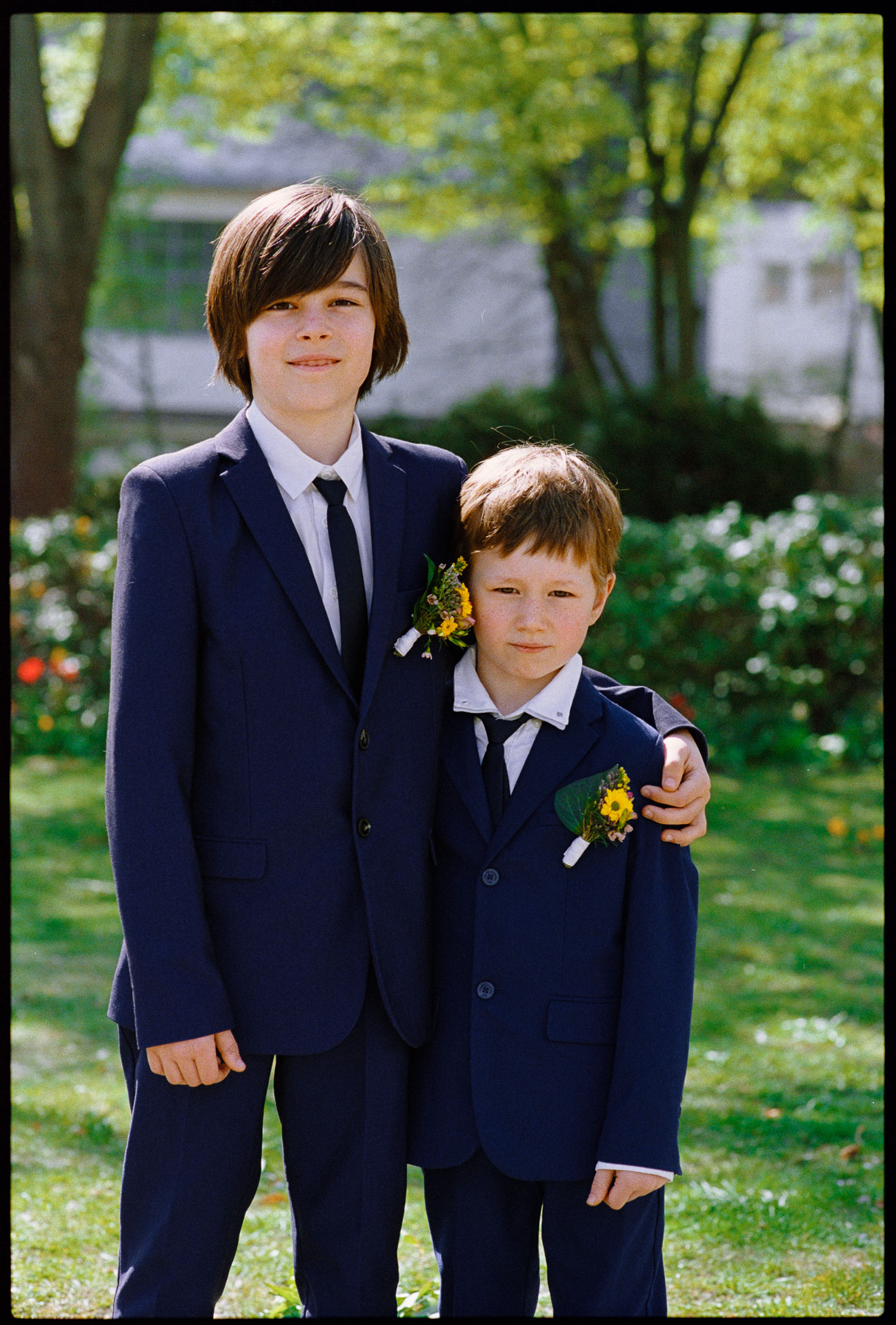 Two boys in suits in the garden, Irena & Peter wedding in Berlin