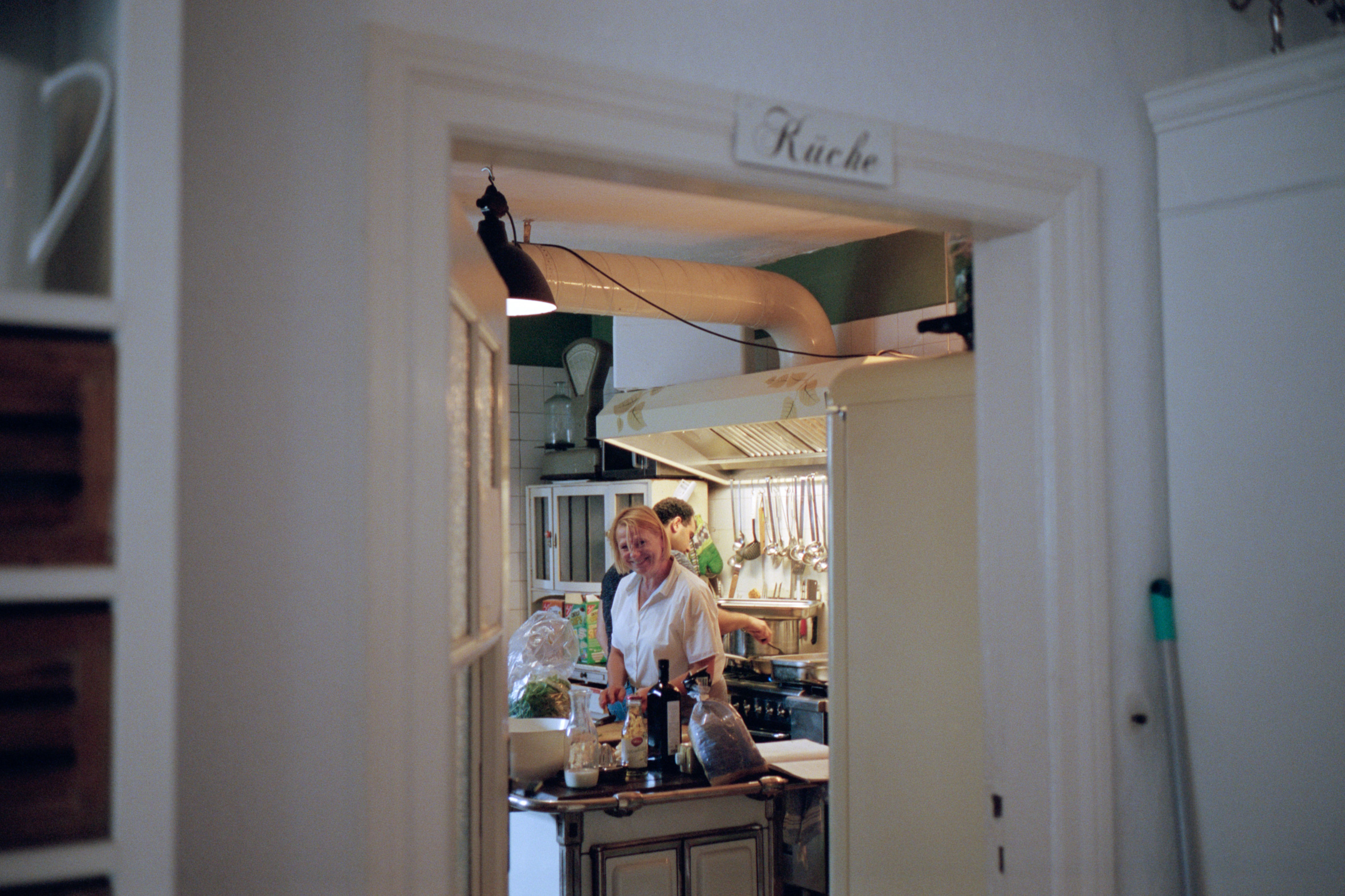 A glimpse through a doorway into the kitchen, Linda & Thomas wedding in Berlin