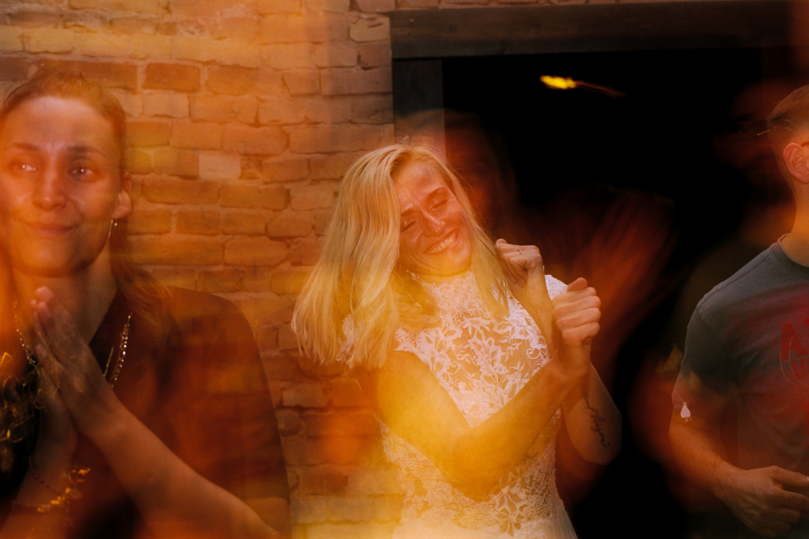 The couple dancing in warm light, a long-exposure film frame, Linda & Thomas wedding in Berlin