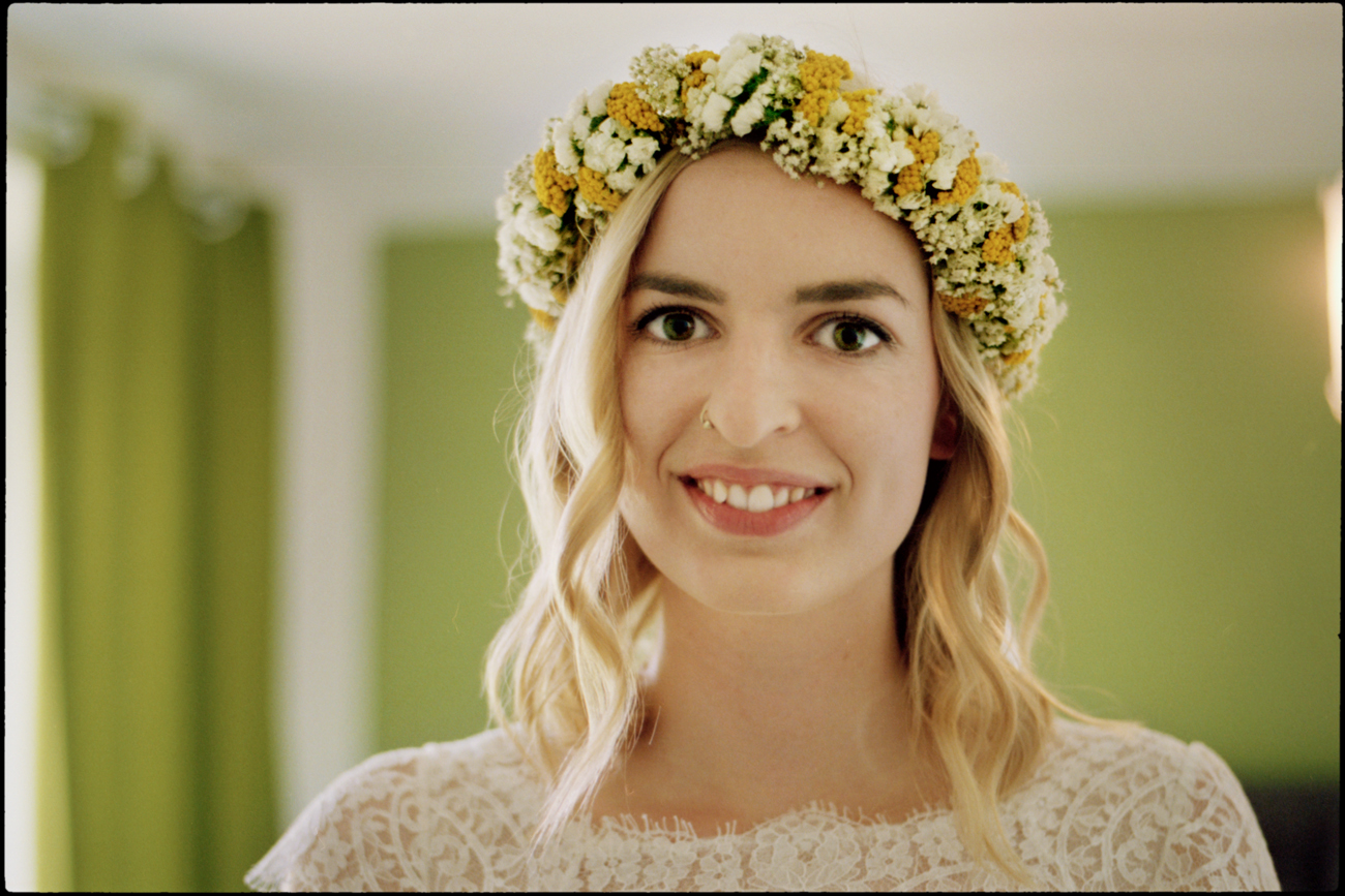 Portrait of the bride wearing a flower crown, Maike & Daniel wedding in Brandenburg