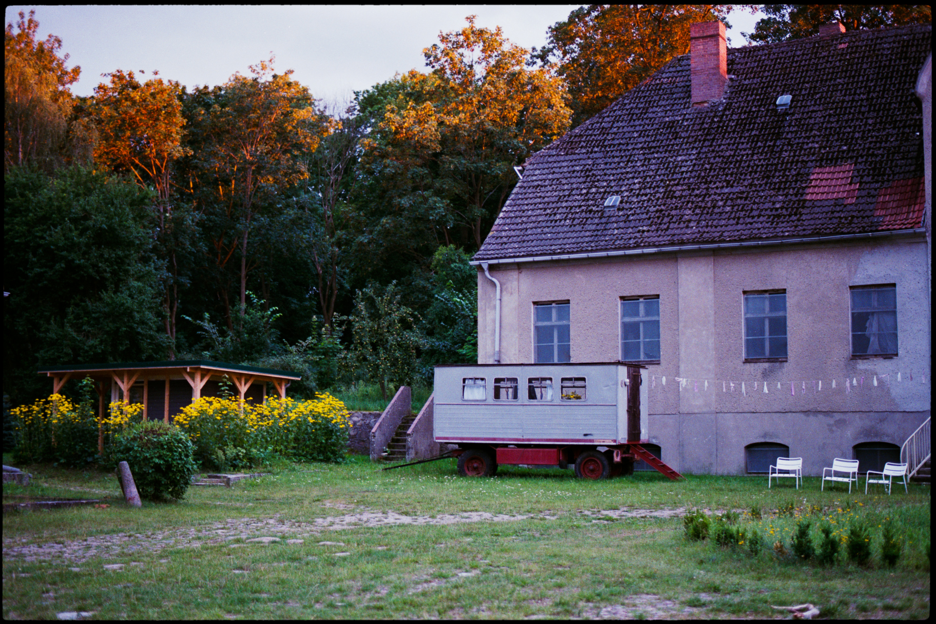 The wedding venue, a country house at dusk, Maike & Daniel wedding in Brandenburg