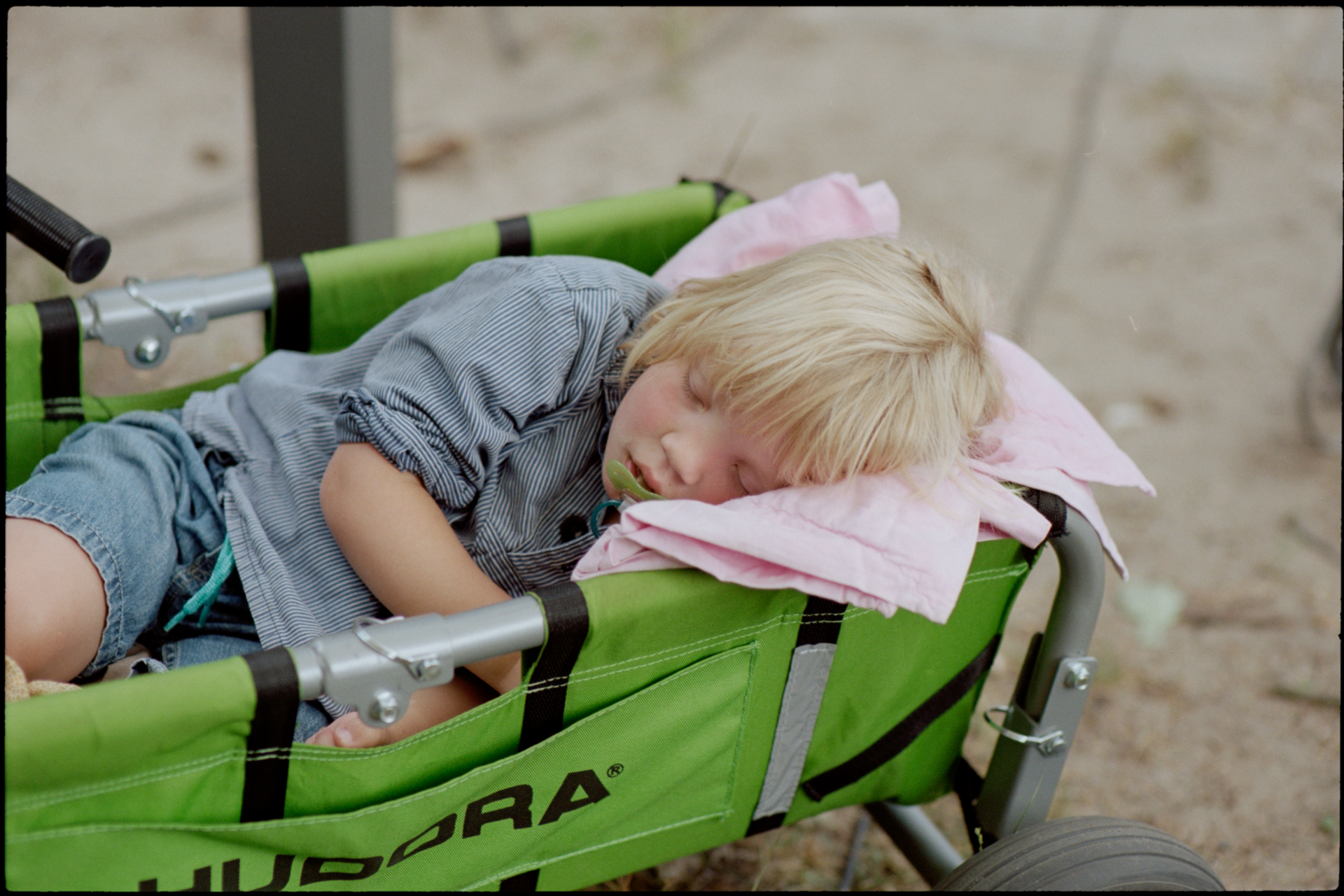 A child asleep in a buggy, Suelyn & Pascal wedding in Groß Glienicke, Potsdam