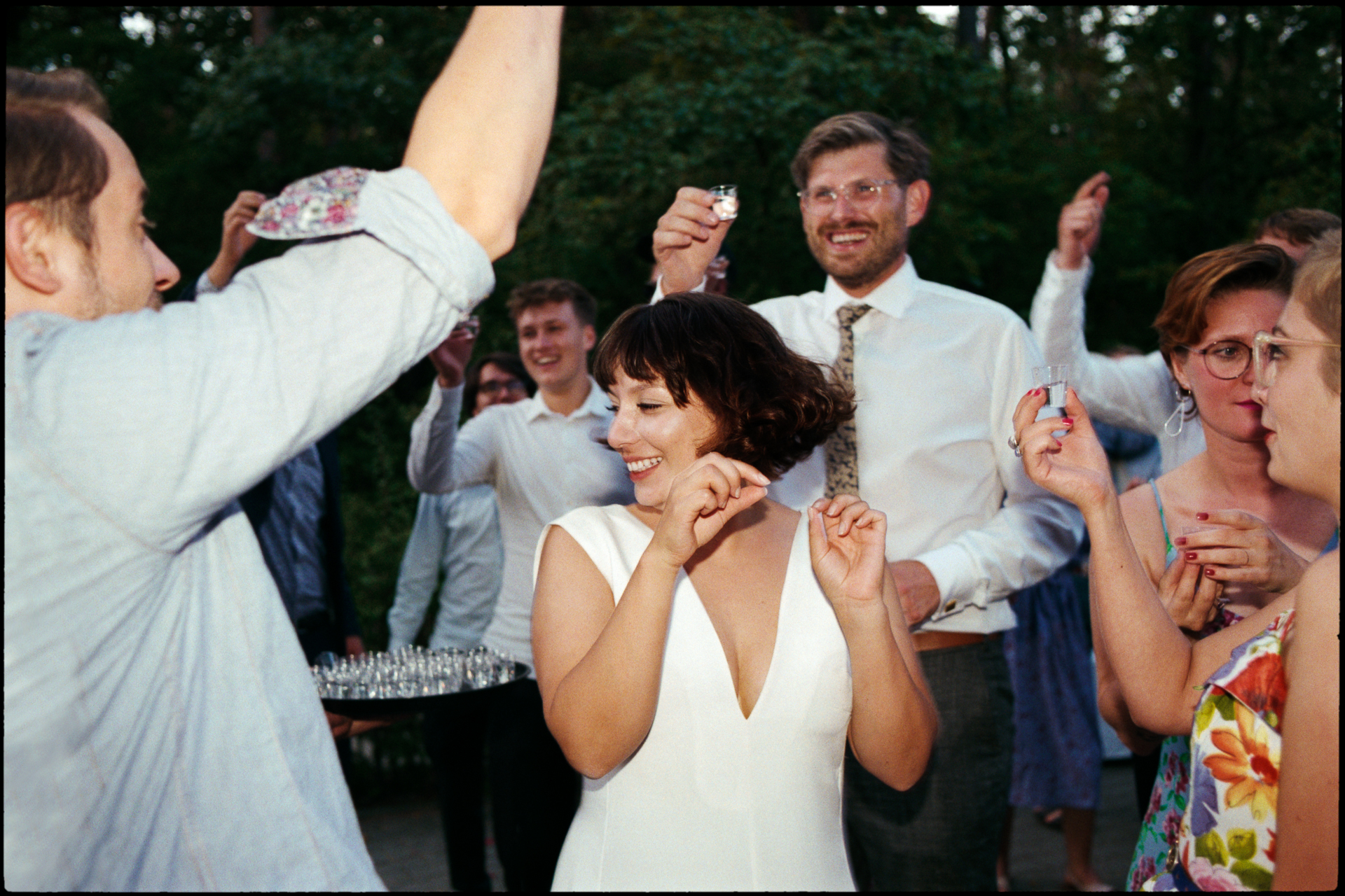 Guests dancing with arms raised, Suelyn & Pascal wedding in Groß Glienicke, Potsdam