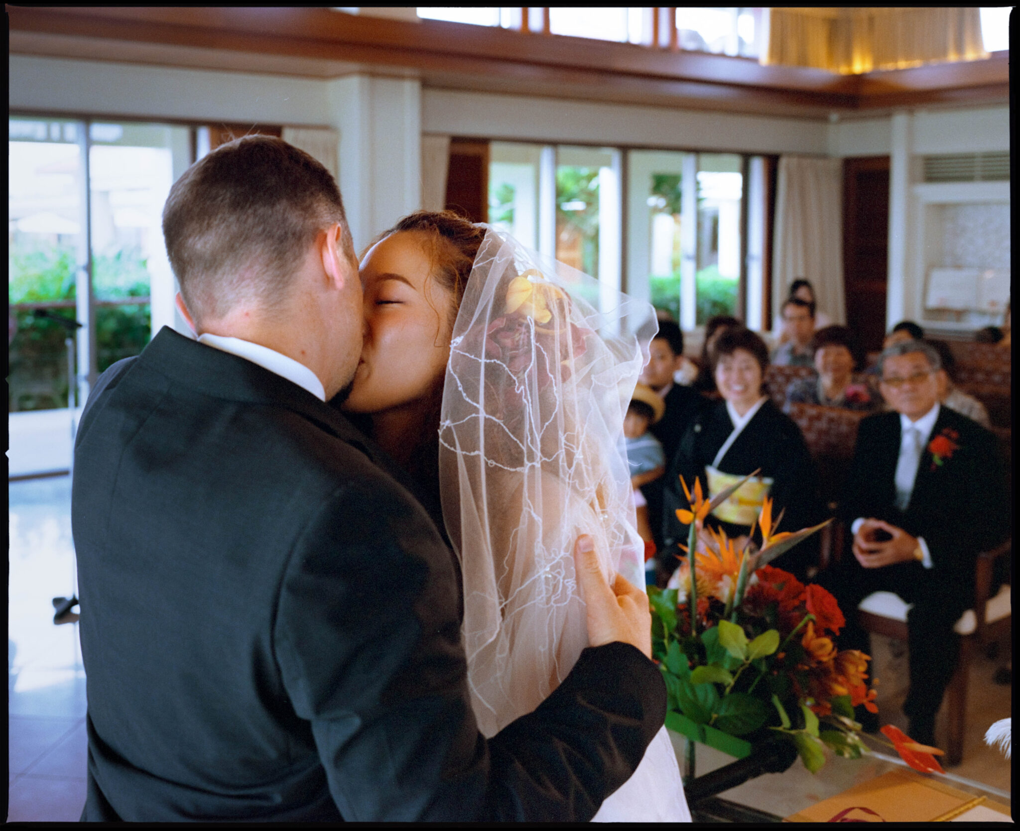 The couple embracing at the ceremony, Sugano & Jonas wedding in Okinawa