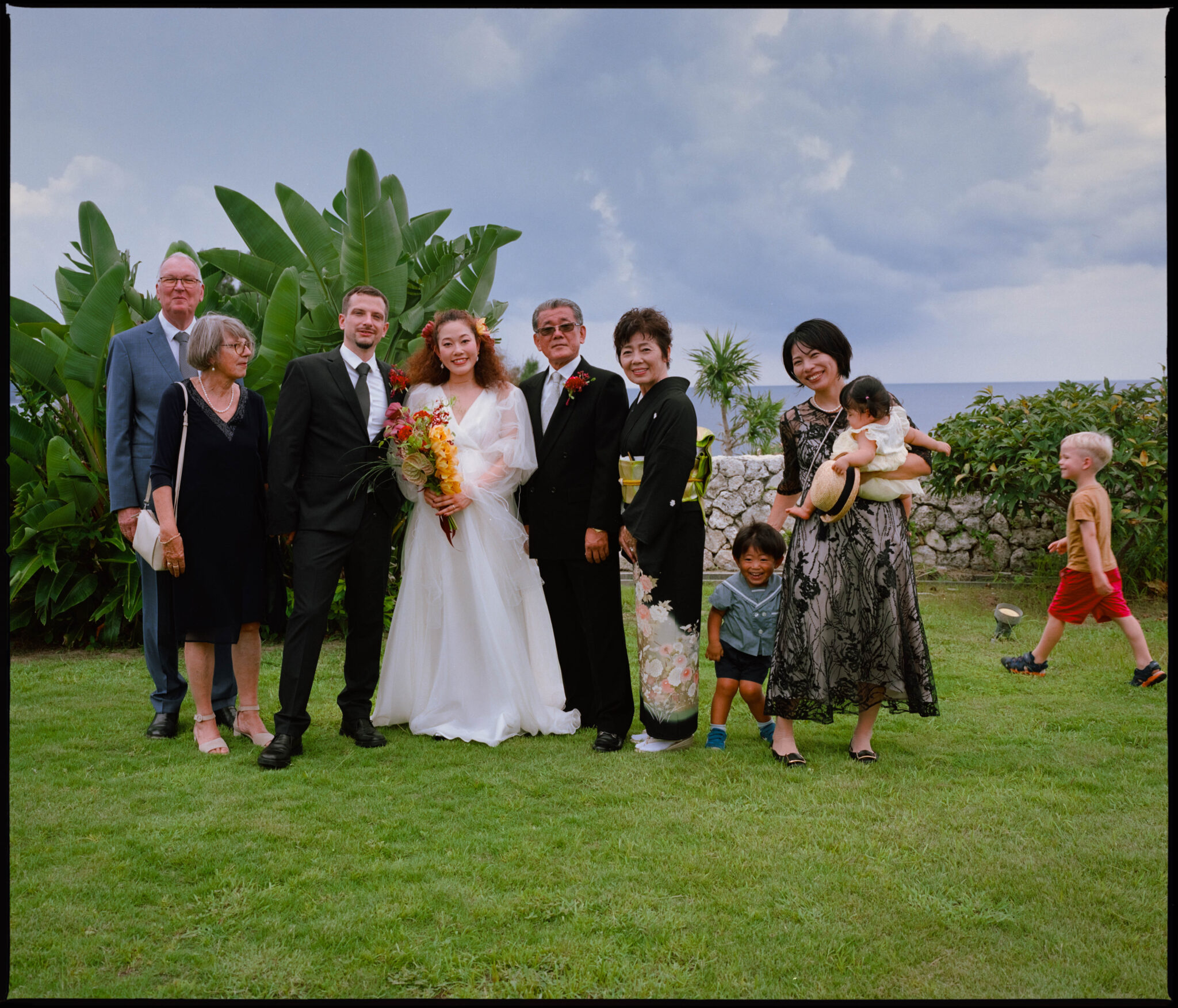 A family group portrait outdoors, Sugano & Jonas wedding in Okinawa