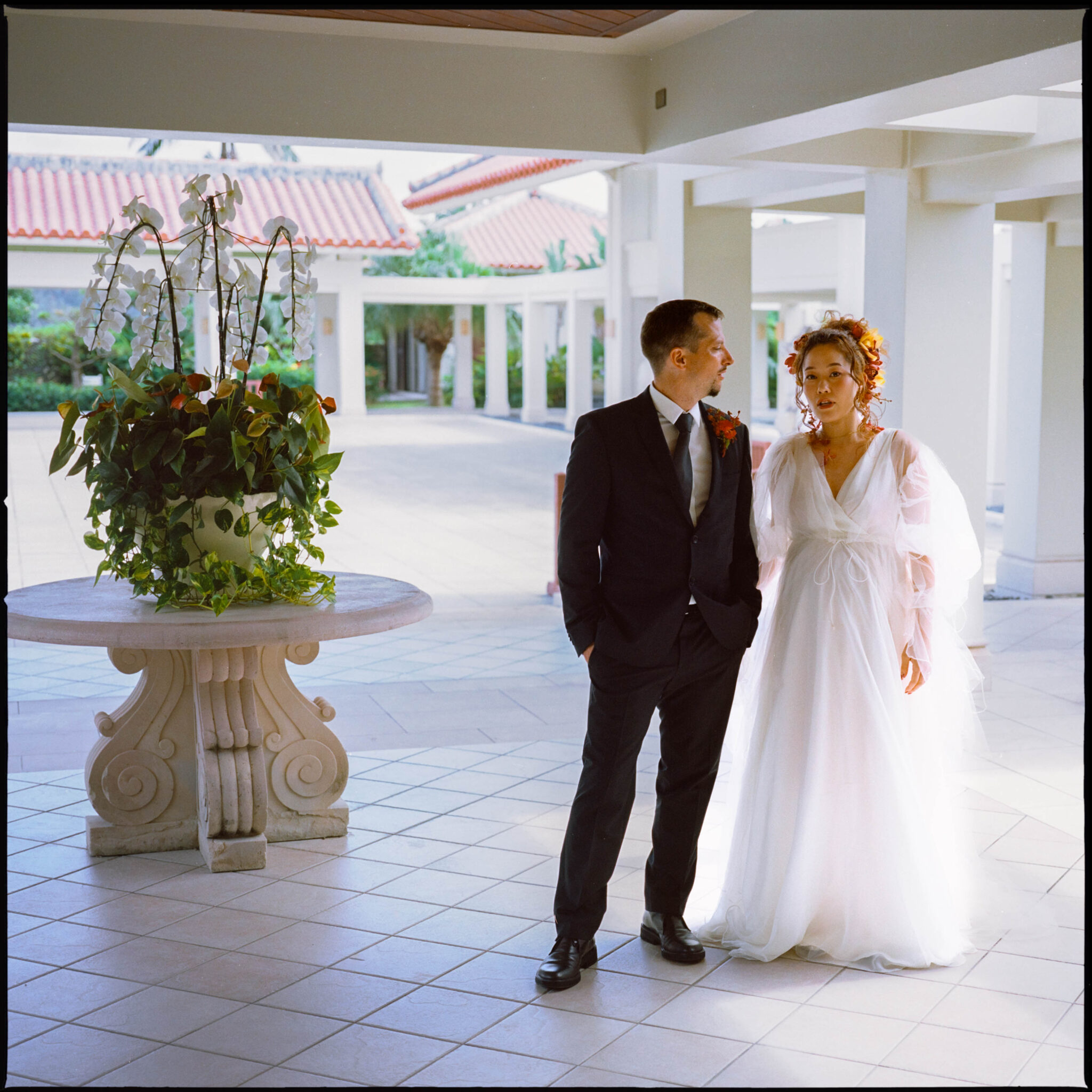 The couple on the terrace before the ceremony, Sugano & Jonas wedding in Okinawa